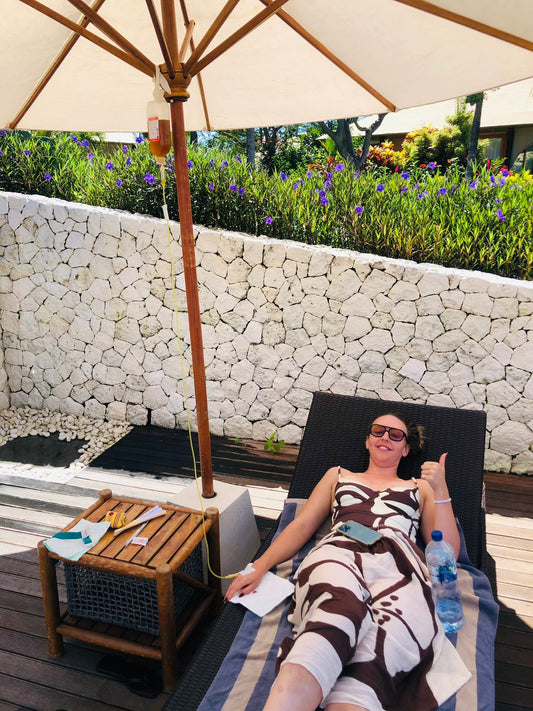 Happy guests receiving IV drip therapy at a Bali villa - Ever Well Health mobile IV service Seminyak